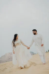 Couple sitting on sand together, Jaipur pre-wedding shoot