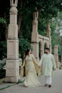 Couple standing at a colorful mosaic gateway