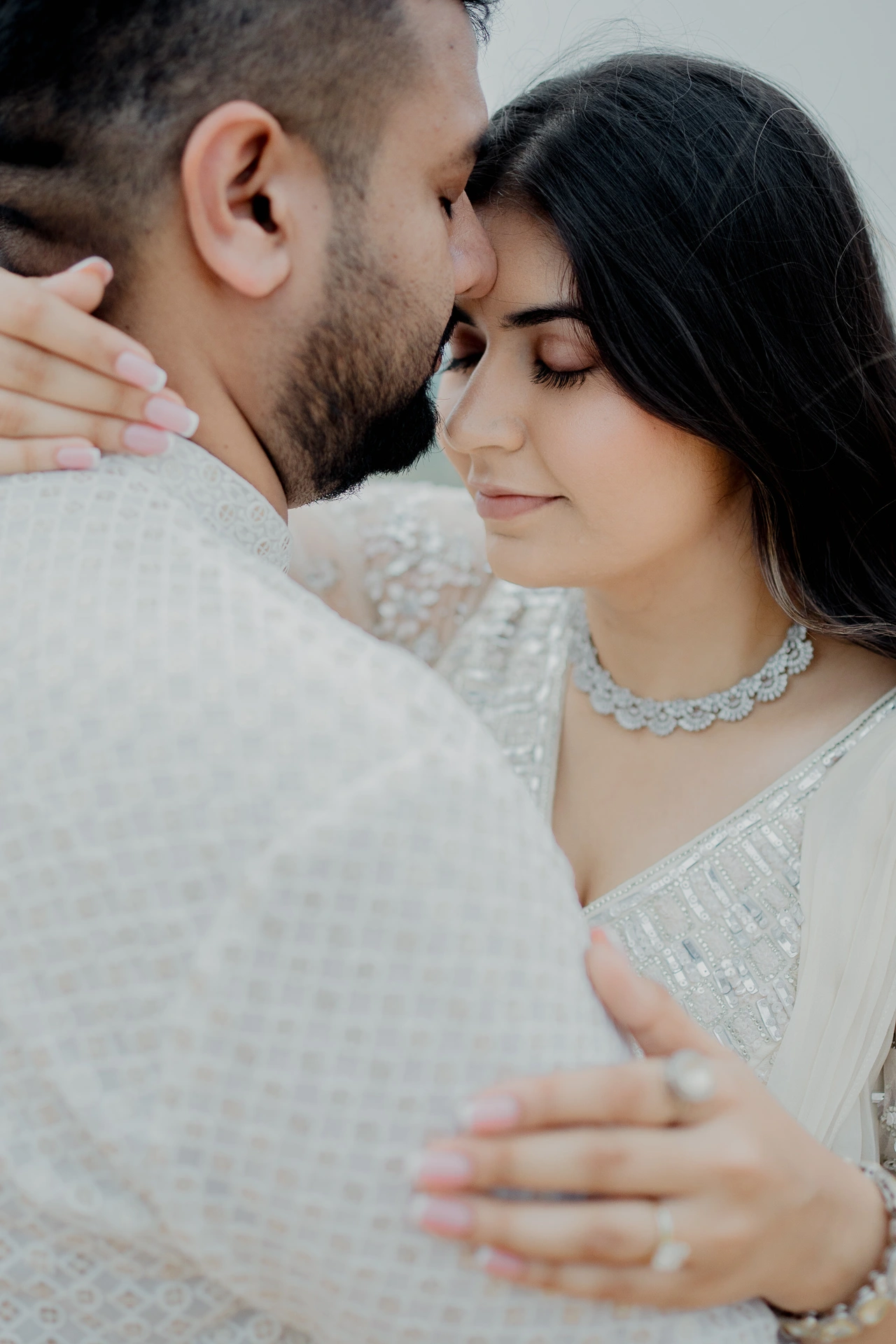 Couple standing close in white outfits, Jaipur pre-wedding shoot
