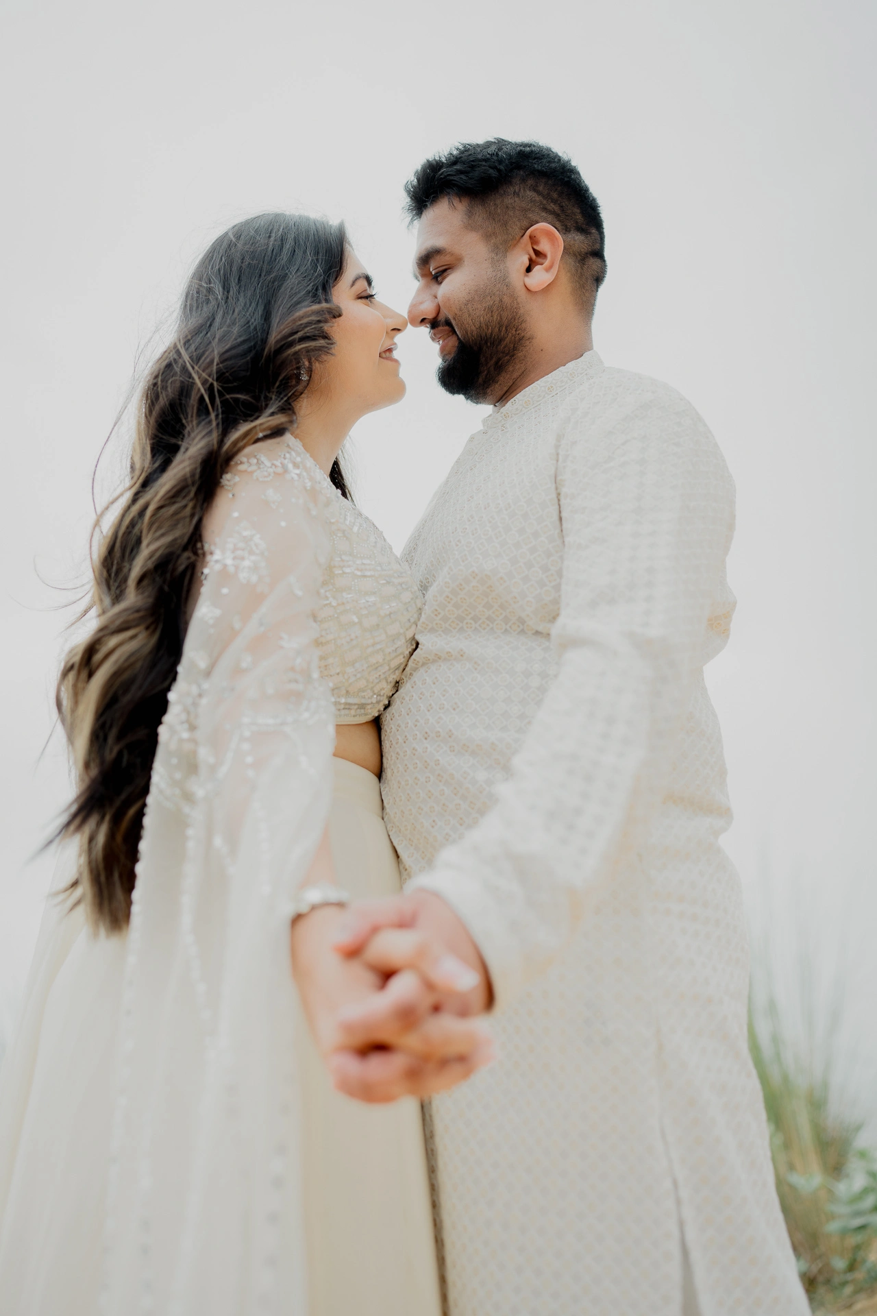 Couple standing close together outdoors
