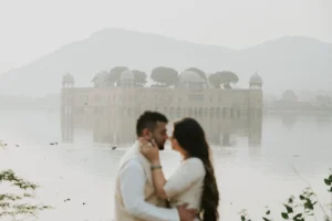 Couple standing close with a misty lake view, Jaipur