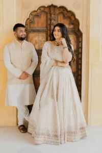 Couple standing in a carved doorway, Amer Fort