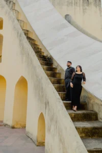 Couple standing on a curved stone stairway