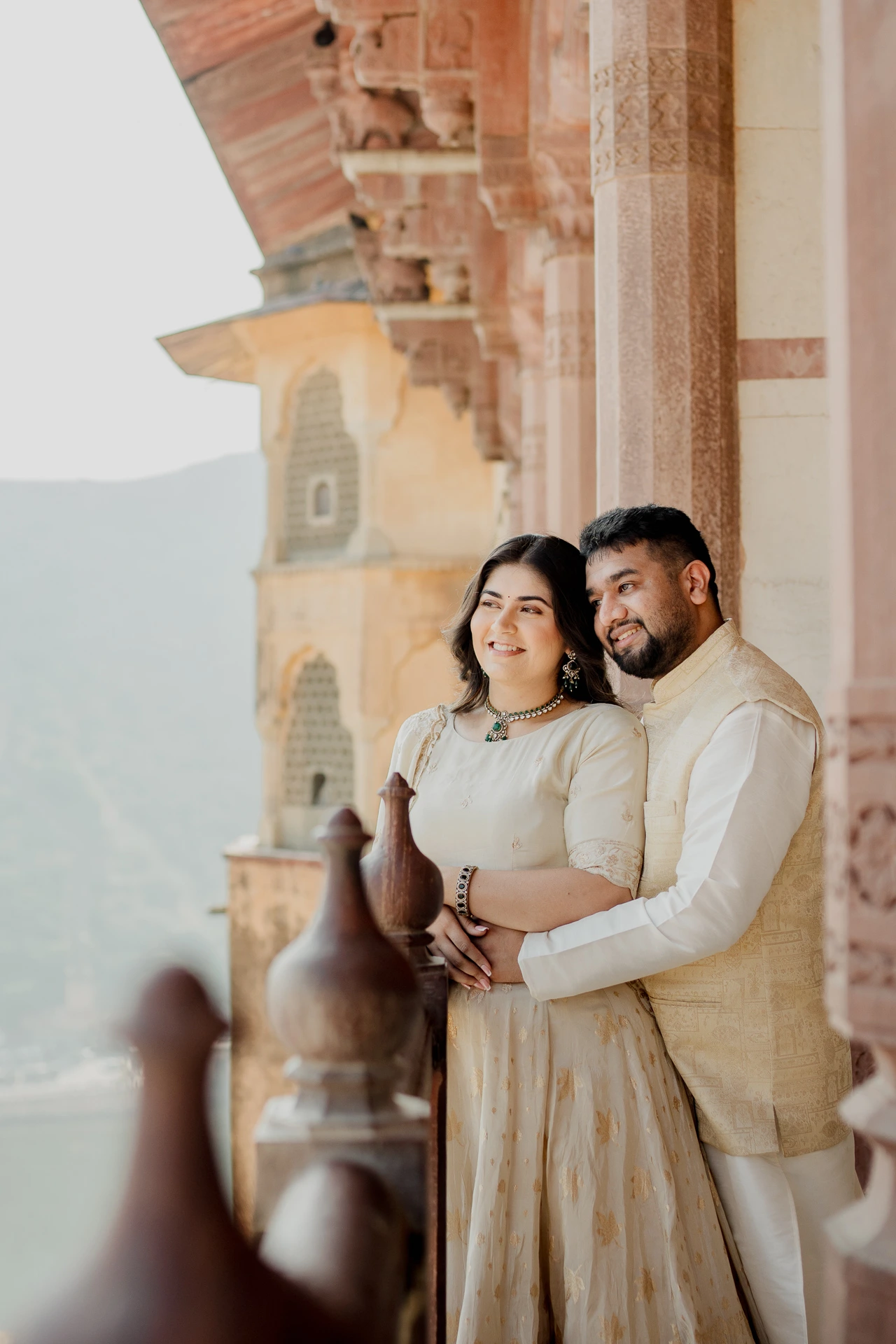 Couple standing on fort steps, Amer Fort Jaipur