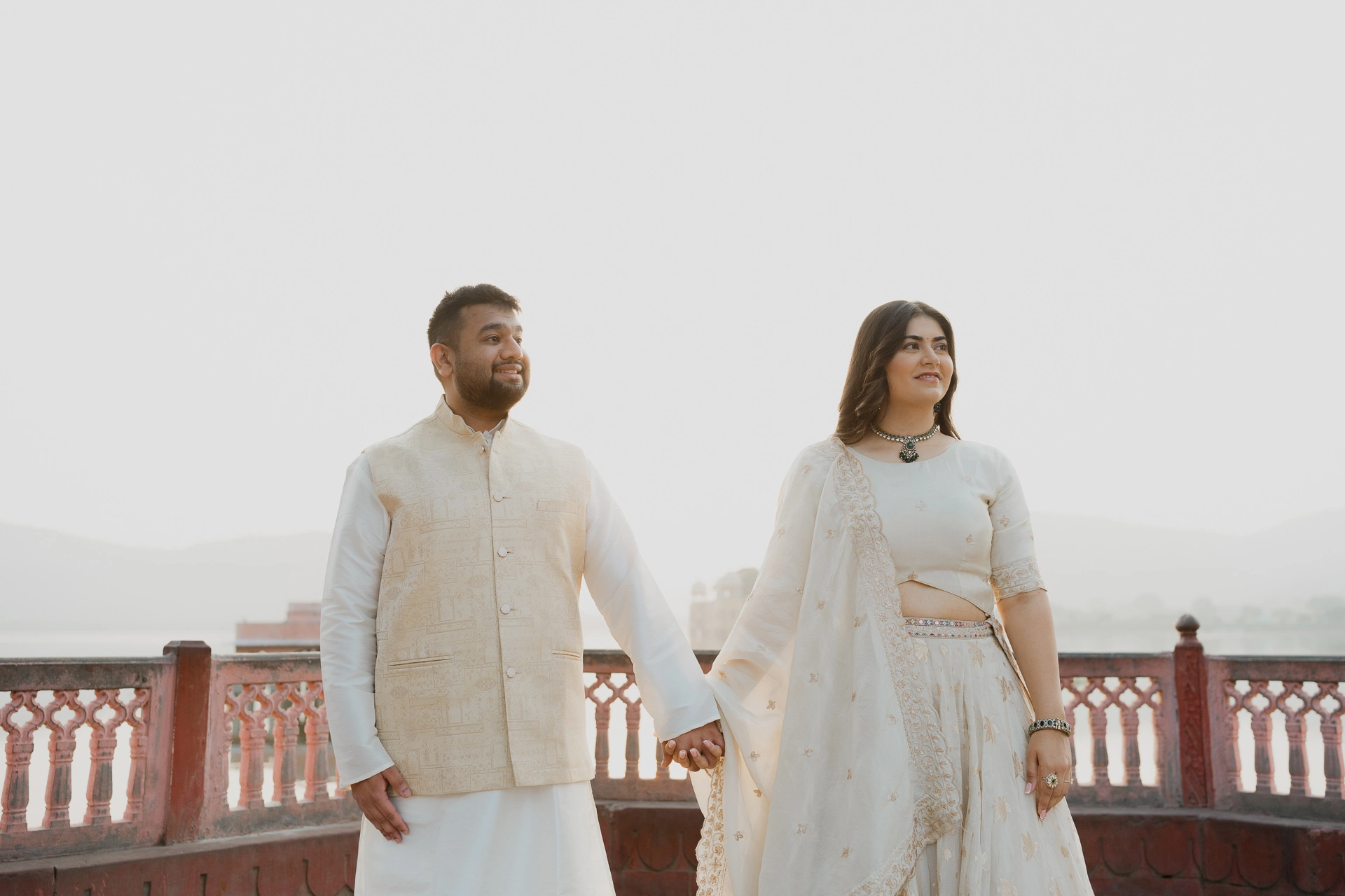 Couple standing side by side on a terrace