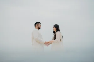 Couple standing together on open ground