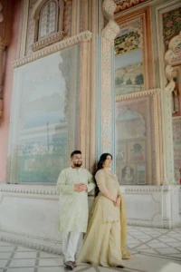 Couple standing under a painted archway