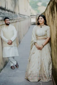 Couple walking down fort steps together, Amer Fort