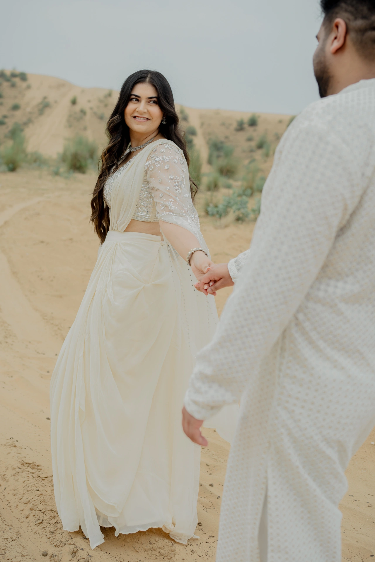 Couple walking hand in hand outdoors, Jaipur pre-wedding shoot