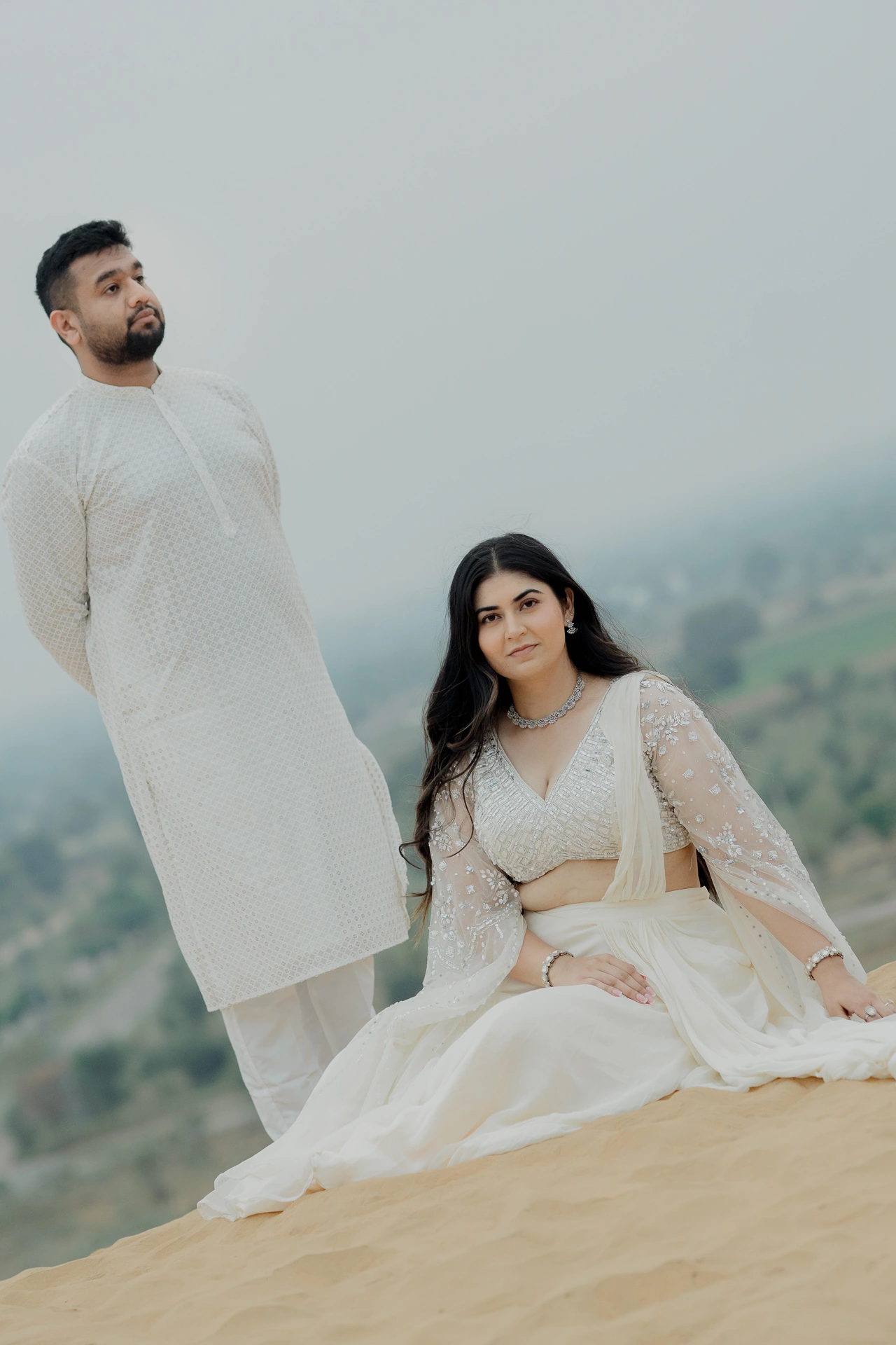 Woman standing alone on a sand dune, Jaipur pre-wedding shoot
