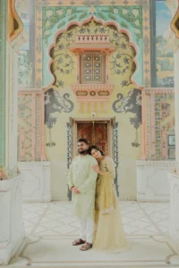Woman standing solo at a mosaic archway, Jaipur pre-wedding shoot
